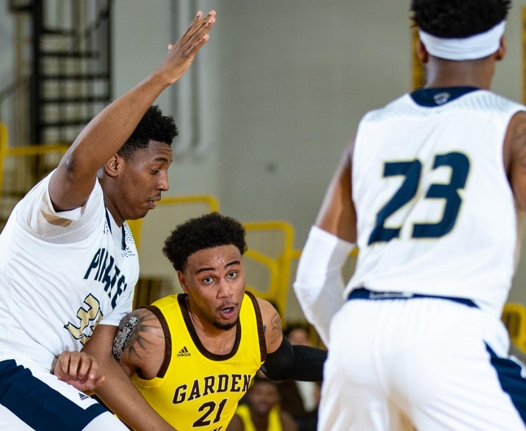 Indy sophomore Jibril Harris(33) defends Broncbusters freshman Tony Hopkins(21) in the 70-65 win over Garden City Community College. Photo by Shrimplin Photography