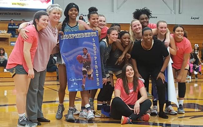 The women's basketball team celebrating sophomore night.
